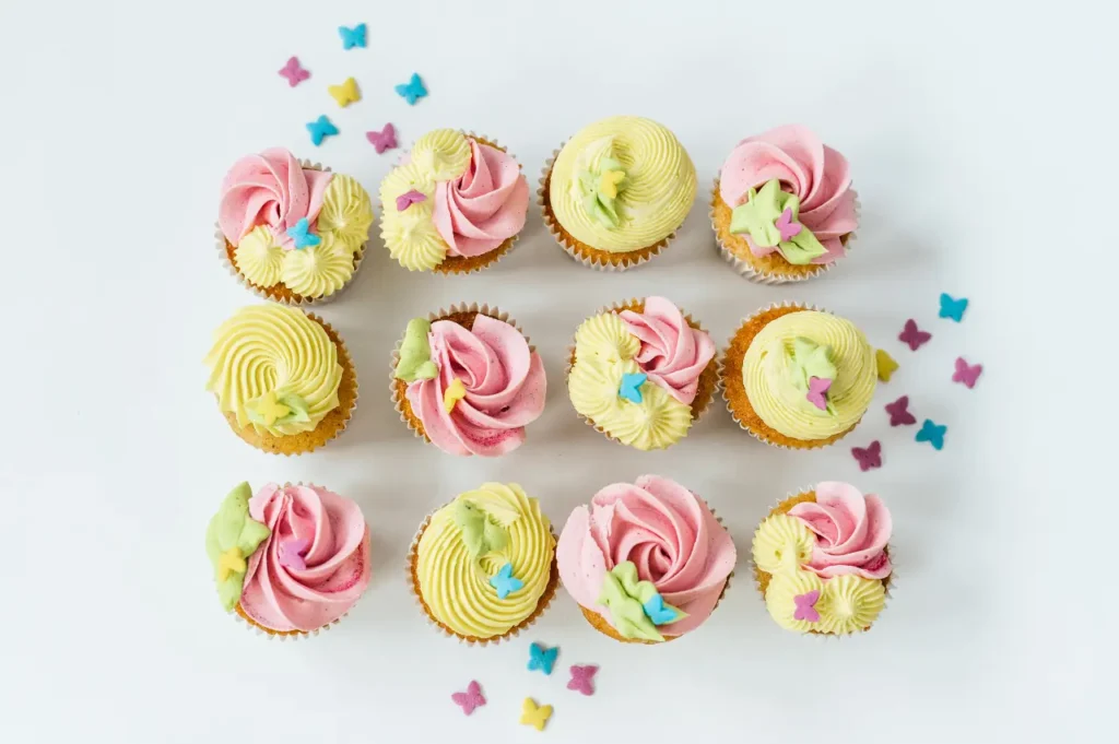 a group of cupcakes with pink frosting