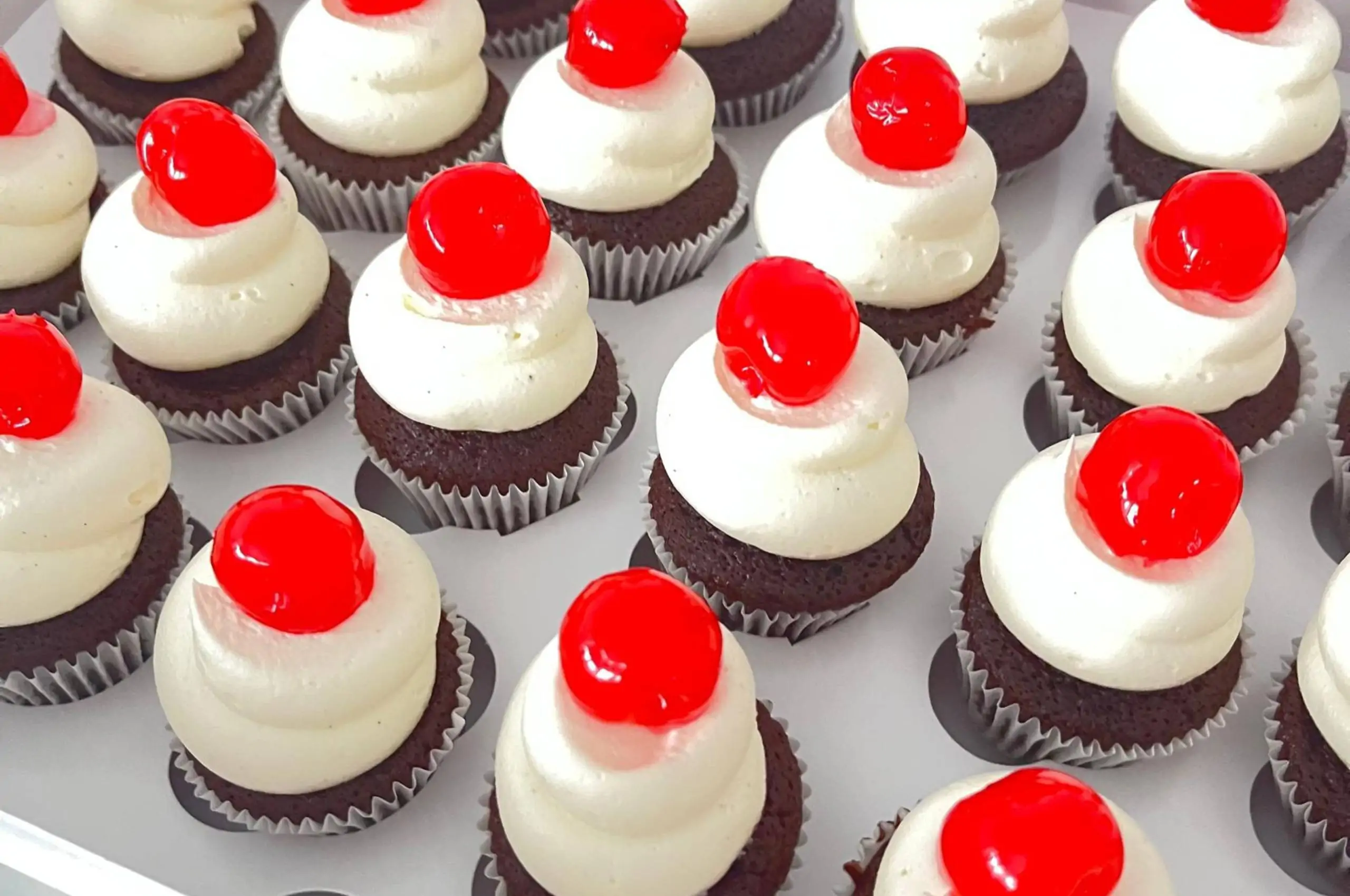 a group of maraschino cherry cupcake